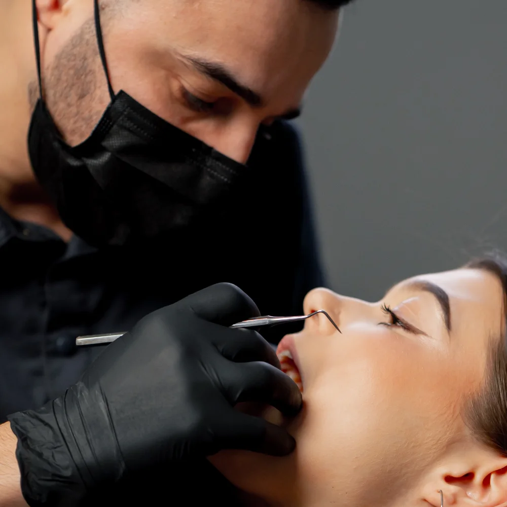 close-up-in-a-dental-office-male-dentist-examines-TG8EWME