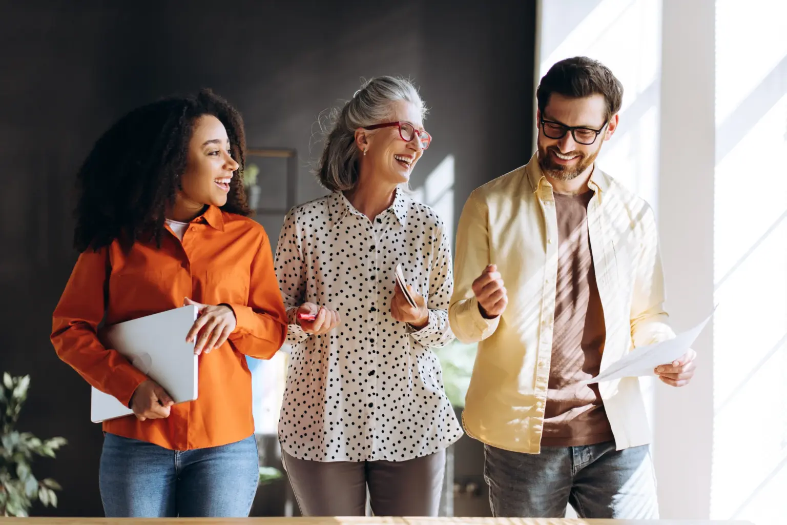 diverse-group-of-happy-business-people-walking-and-7AZLY3P